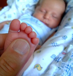 This photo of a dad holding his infant child's foot was taken by Marcello U from Santa Fe, NM.